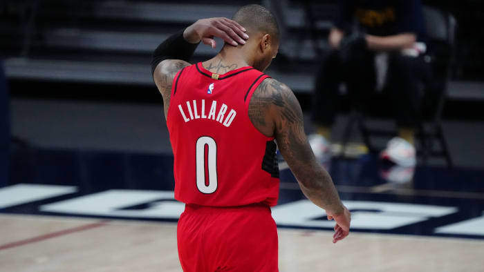Portland Trail Blazers guard Damian Lillard (0) leaves the court after a double overtime loss to Denver Nuggets during game five in the first round of the 2021 NBA Playoffs. at Ball Arena.
